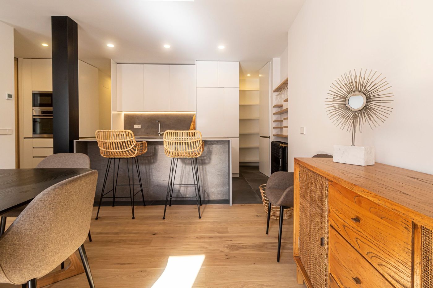 A bright, modern living space with contemporary furniture in a holiday apartment in Funchal.