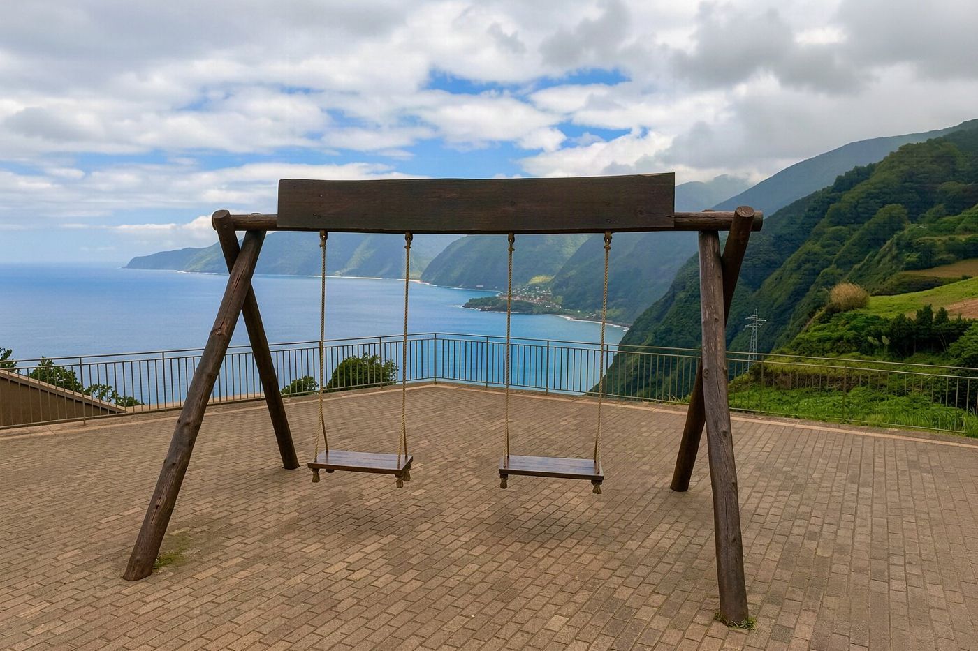 The glass skywalk platforms hanging over the sea at Ninho da Manta viewpoint.