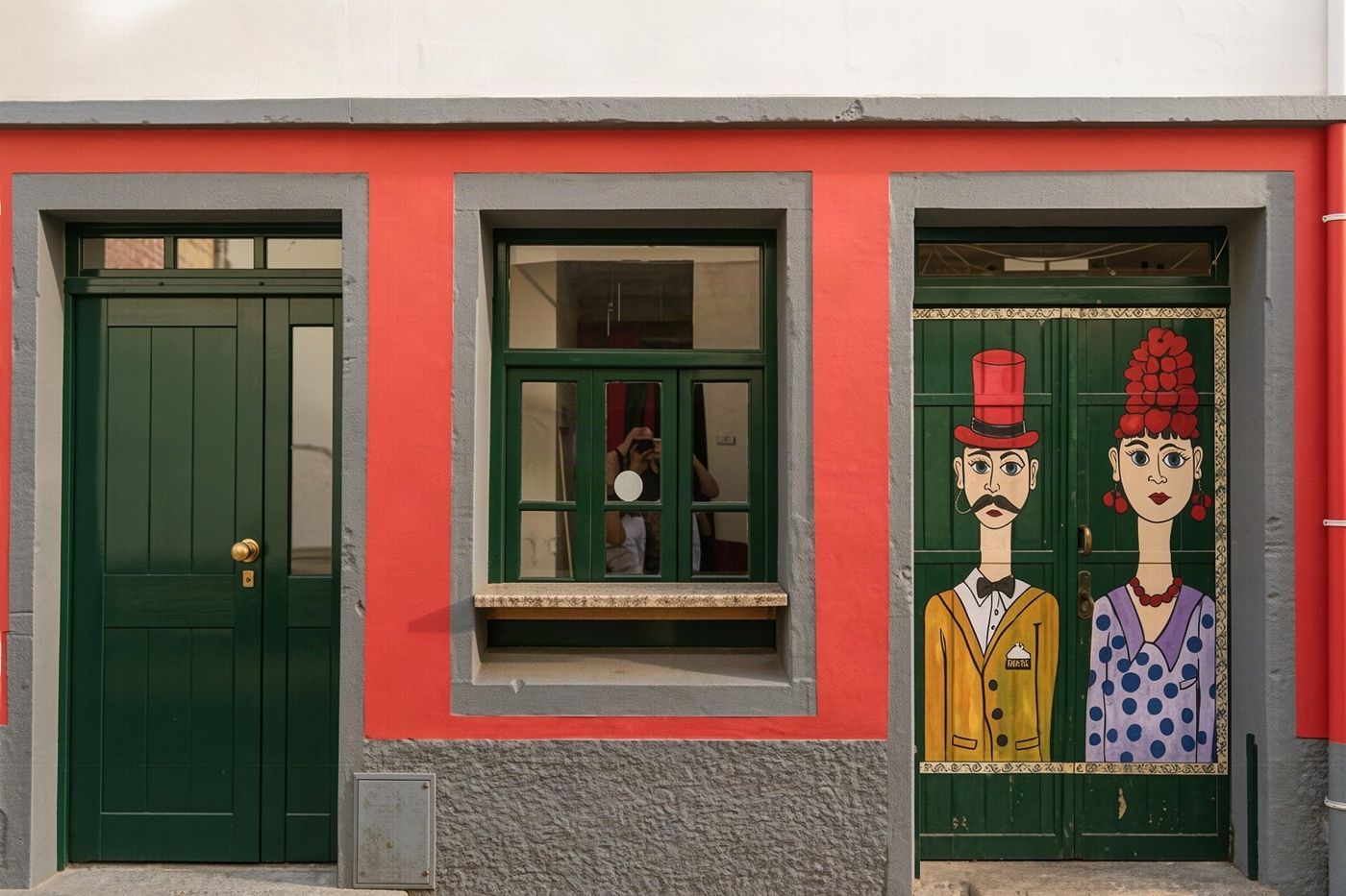 Historic wooden doors and buildings along Rua de Santa Maria in the Funchal old town.