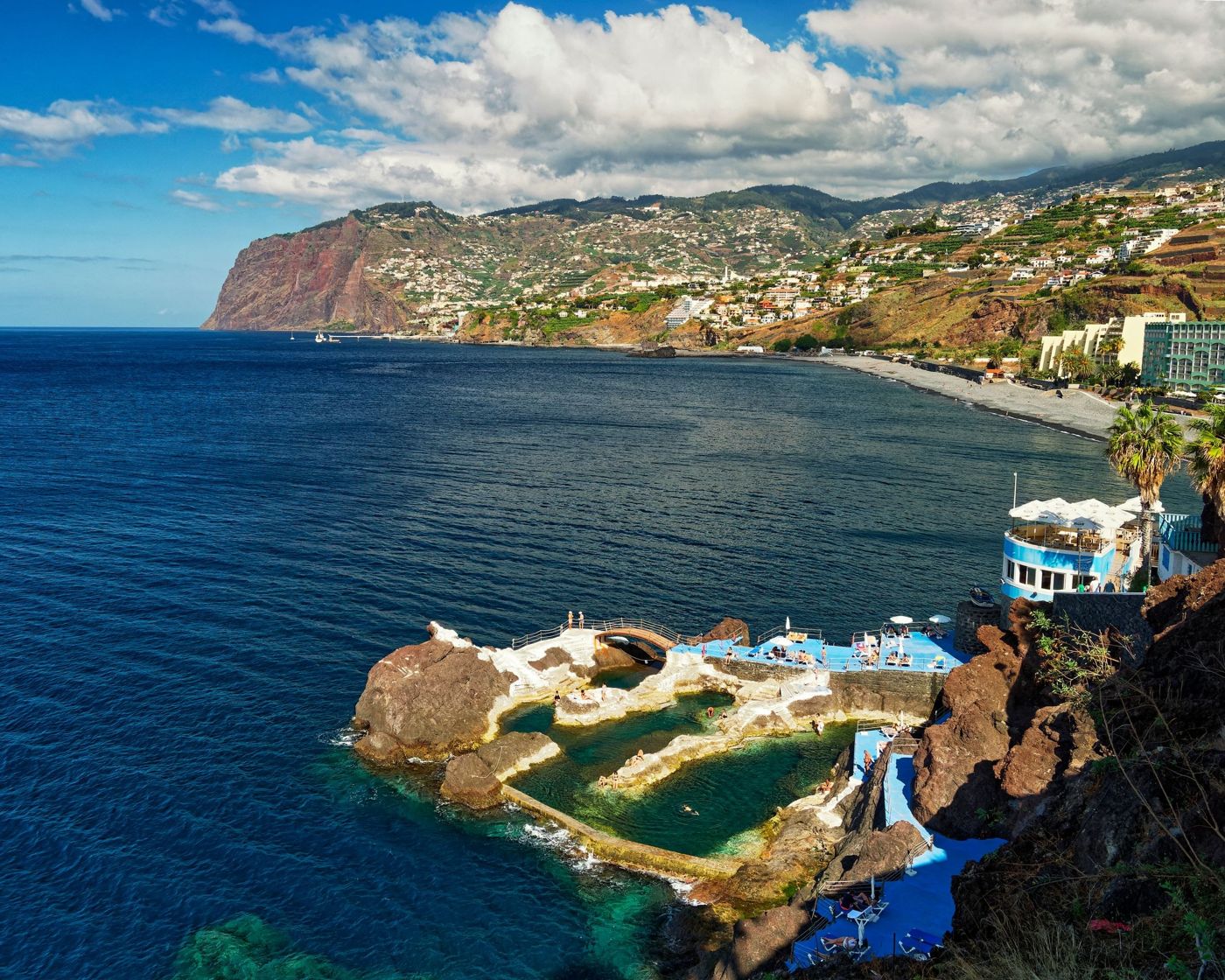 The swimming pool and garden area of the Savoy Palace hotel situated on a cliff in São Martinho.