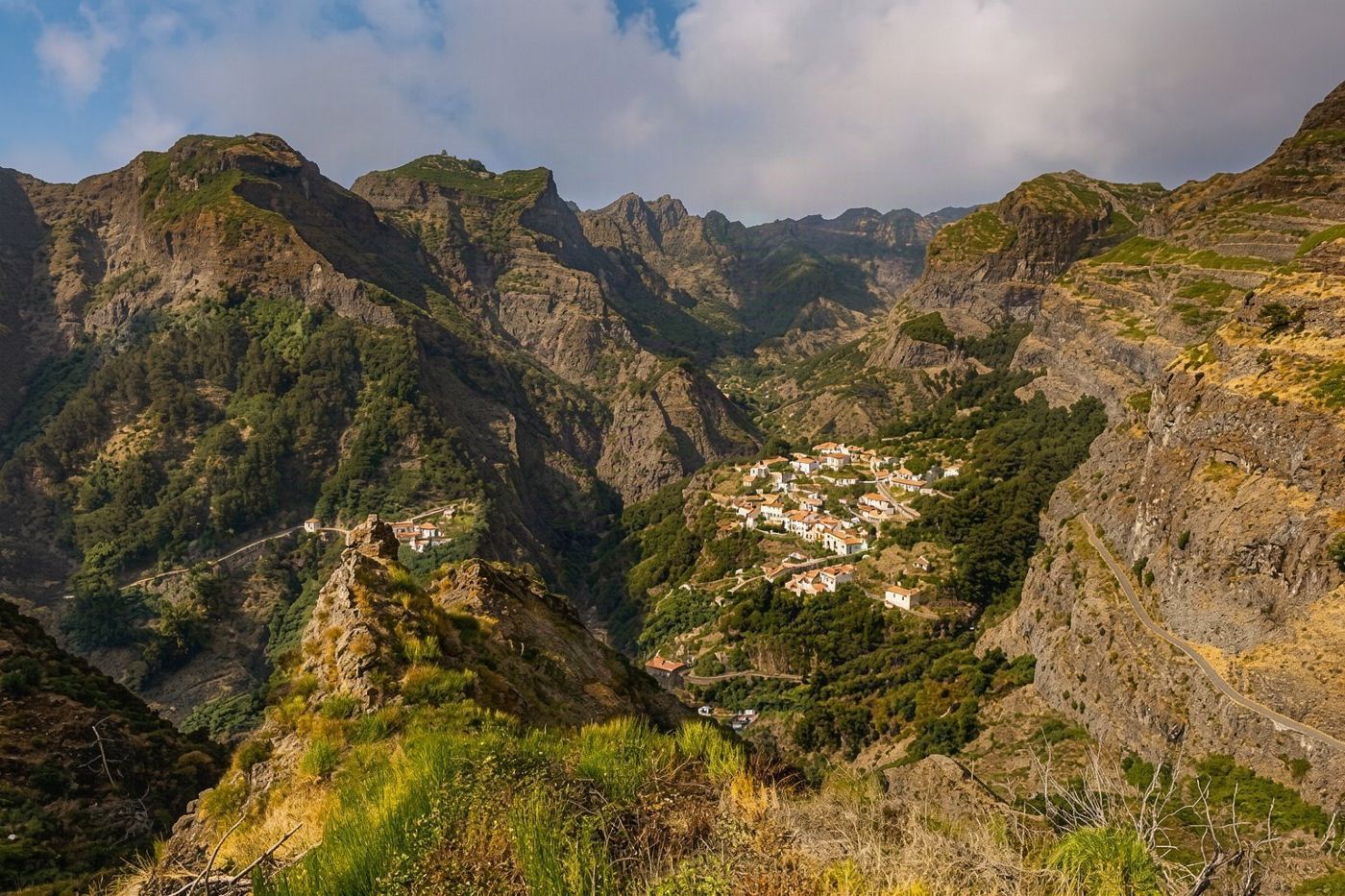 A panoramic view looking down into the hollow valley where the village of Curral das Freiras is situated.